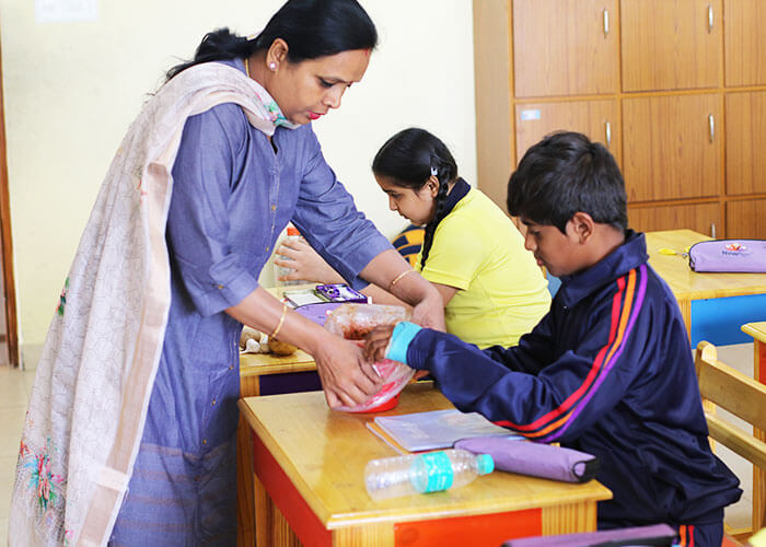 Students exploring nature in classroom garden - International Schools in North Bangalore