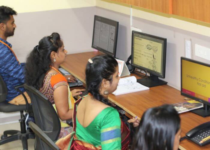 Teacher conducting an interactive session on digital tools for academic excellence at NewAge World School, North Bangalore.