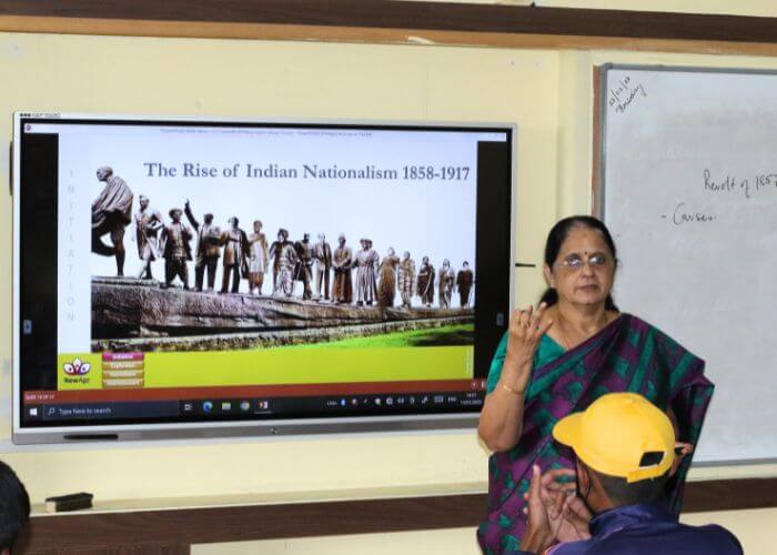 Students engaged in an interactive lesson on Indian nationalism using smartboards at NewAge World School, an international ICSE school.