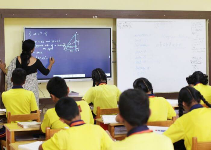Students engaged in interactive learning with advanced digital classrooms at NewAge World School, one of the Best ICSE Schools in Yelahanka.