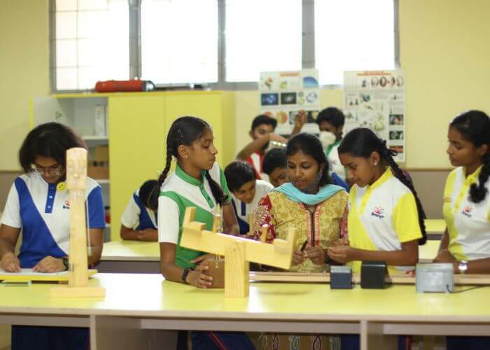 Students collaborating on STEM activities in the learning lab at NewAge World School, a best ICSE school in Bangalore.