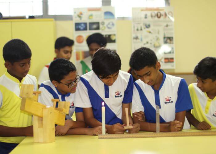 Hands-on science experiments conducted by students at NewAge World School, one of the Best Schools in Bangalore.
