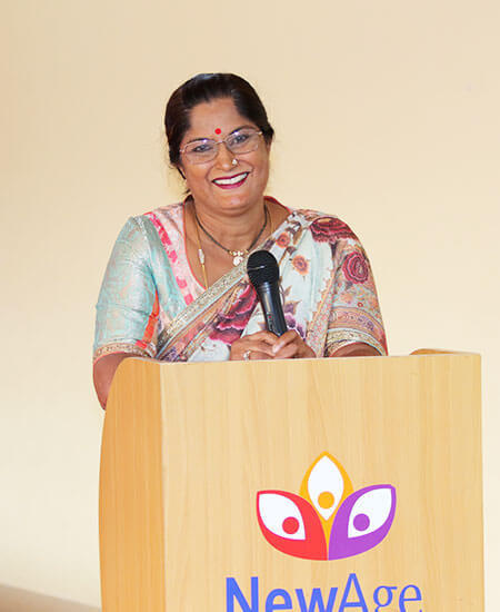 Mrs. Rama B Raj addressing parents and students, representing the management of NewAge World School, the best ICSE school in Yelahanka, Bangalore.
